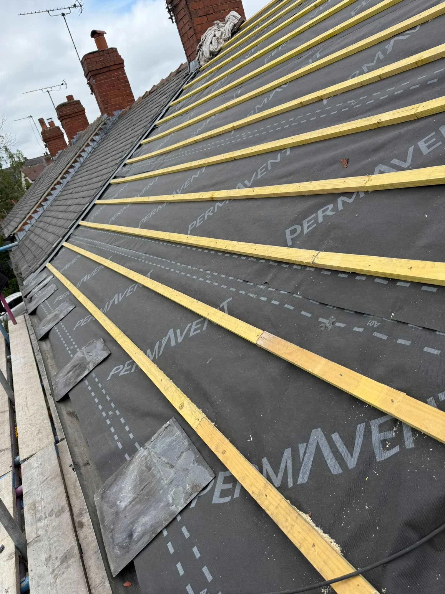 Roof membrane and timber battens during roofing preparation